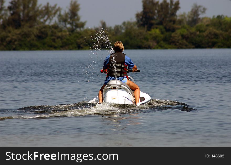 Lady on a jet ski. Lady on a jet ski