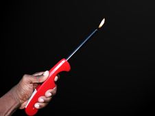 Hand Holding A Lighter Isolated By A Clipping Path Stock Images