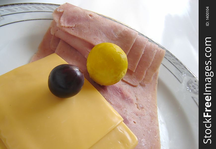 Gourmet dish with ham, cheese and olive. Gourmet dish with ham, cheese and olive