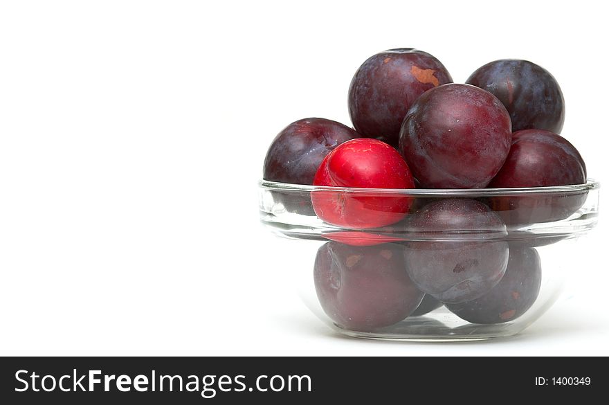 Bowl of Plums against a white background