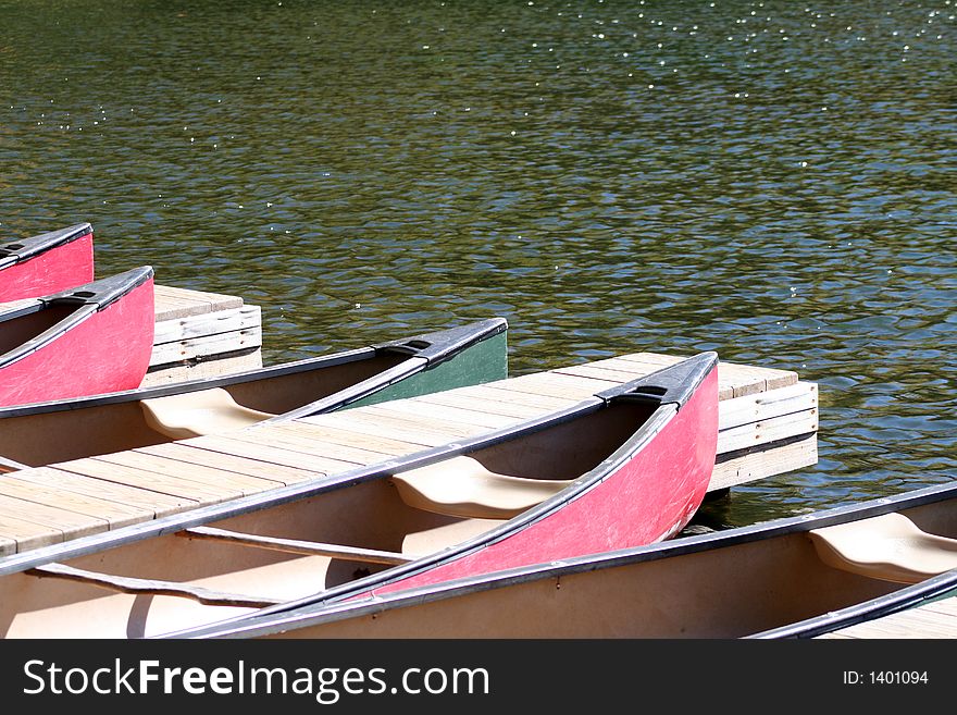 Canoes sitting on the lake