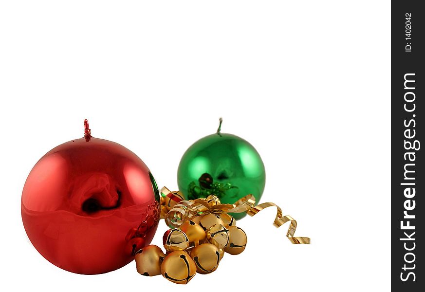 Red and green metallic Christmas candles with gold bells