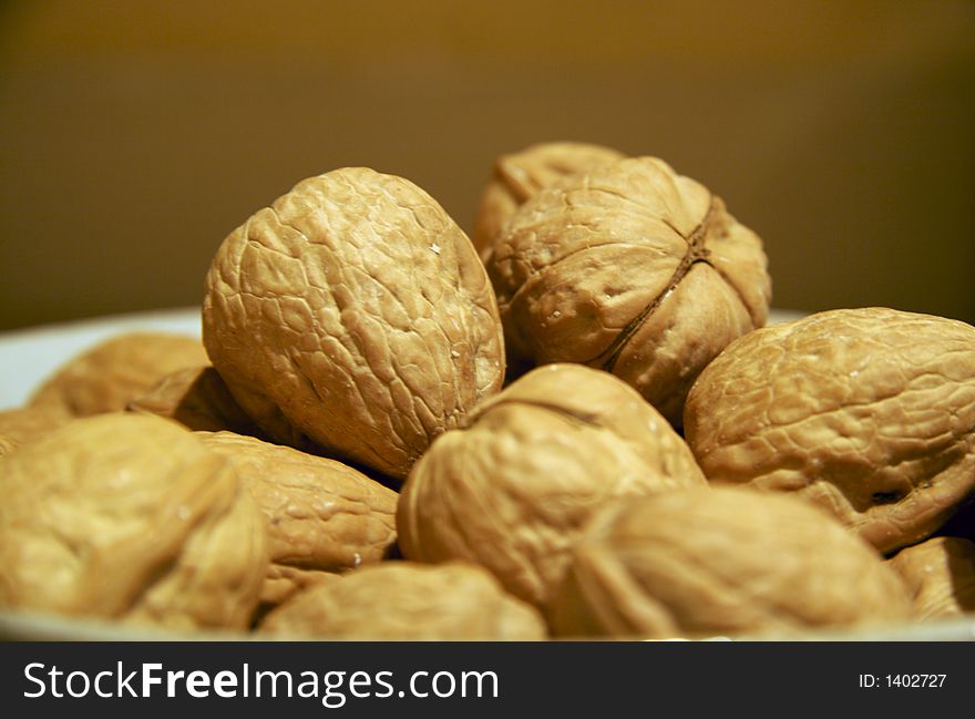 Bowl full of whole walnuts