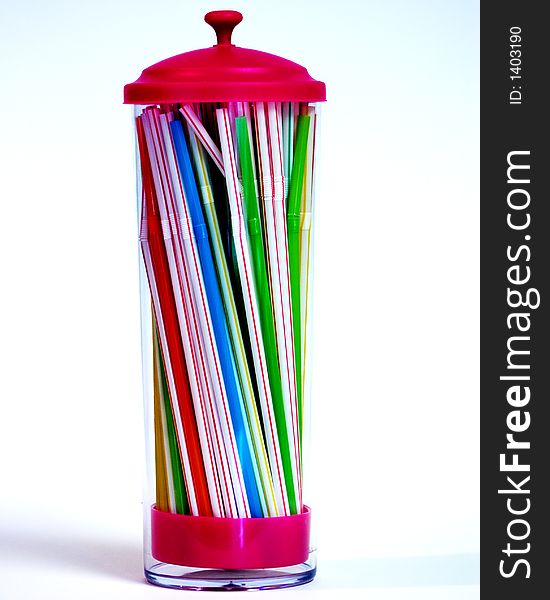 A straw holder with an assortment of colorful straws