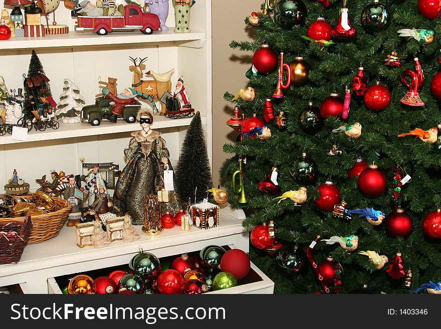 Cropped shot of a christmas tree dotted with decorations, and shelves full of all kinds of christmas items. Cropped shot of a christmas tree dotted with decorations, and shelves full of all kinds of christmas items