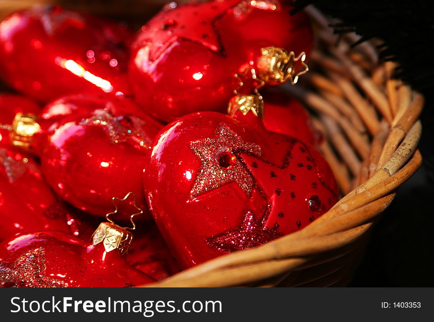 Cropped shot of red christmas ornaments in the shape of a heart