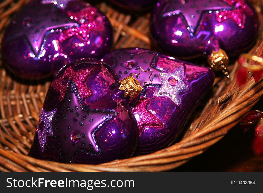 Shot of violet colored christmas ornaments in the shape of a heart. Shot of violet colored christmas ornaments in the shape of a heart