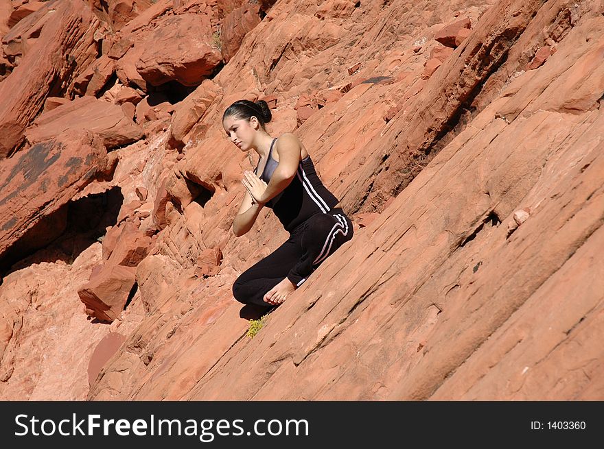 A girl doing yoga in Red Rock Canyon, Las Vegas Nevada. A girl doing yoga in Red Rock Canyon, Las Vegas Nevada