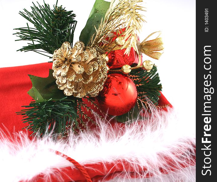 Christmas decorations on red bag on white background