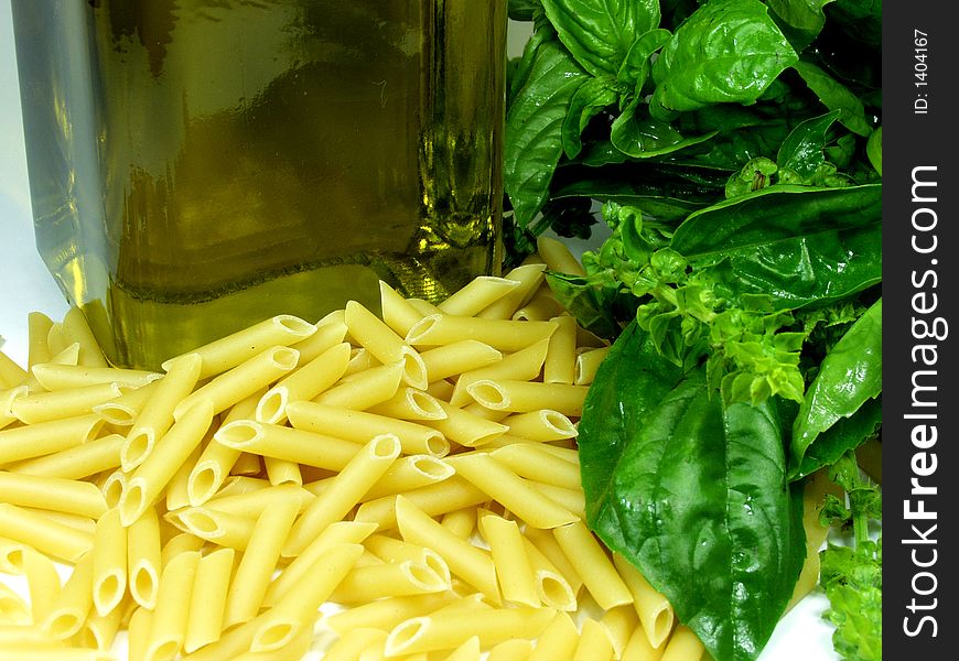 Macarroni whit basil leaves and olive oil. Macarroni whit basil leaves and olive oil