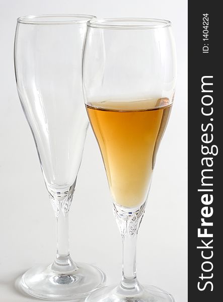 Two wine glass isolated over a white background