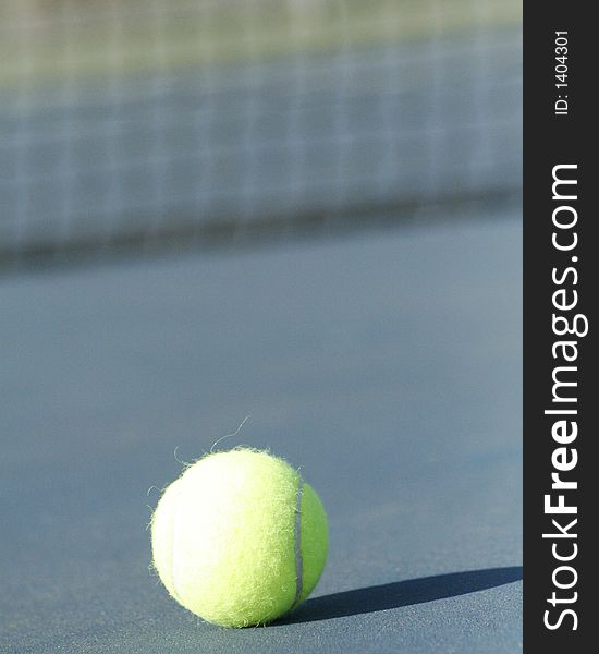 Selective focus image of a tennis ball. could be used for sports and travel destinations or a background. Selective focus image of a tennis ball. could be used for sports and travel destinations or a background.