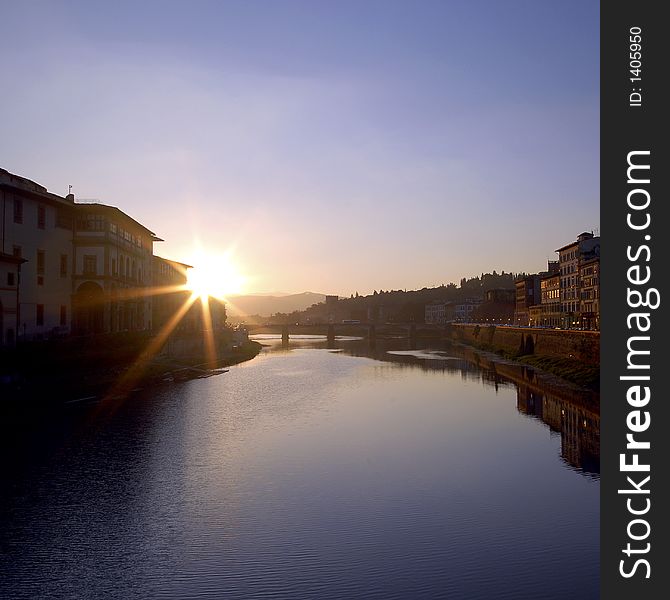 Sun rise over the Arno river in Florence, see from Ponte Vecchio. Sun rise over the Arno river in Florence, see from Ponte Vecchio.