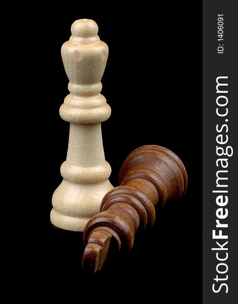 Male and Feamle chess pieces isolated on a black background