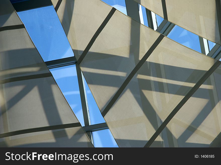 Abstract of shapes with reflected sky and shadows