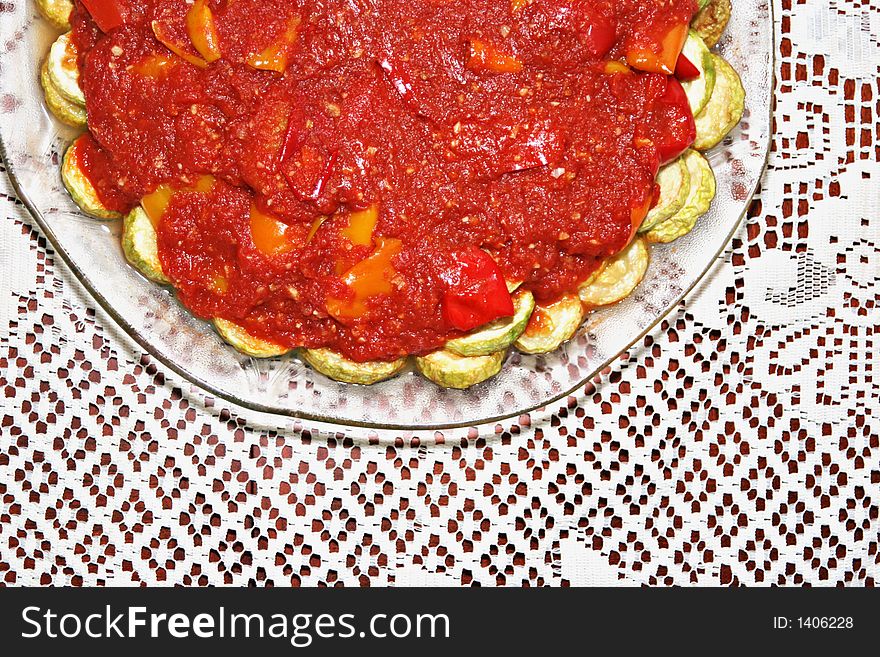 Plate of zucchinis with tomato sauce