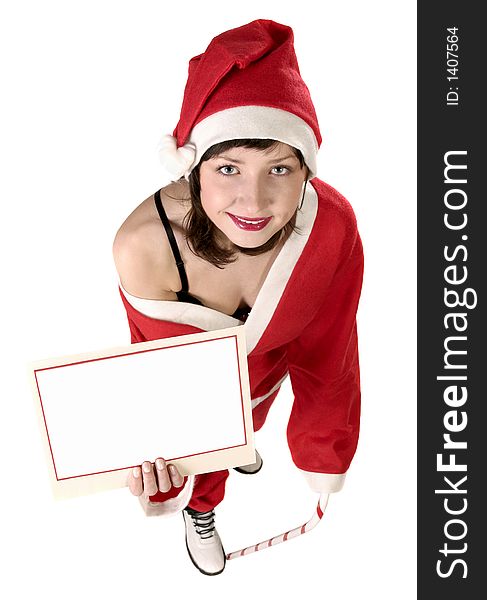 Young woman in  a red and white santa fancy dress holding a card, add text here. Young woman in  a red and white santa fancy dress holding a card, add text here
