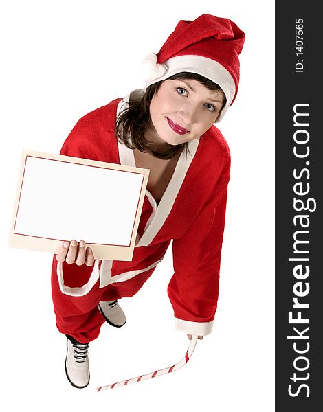 Young woman in  a red and white santa fancy dress holding a card, add text here. Young woman in  a red and white santa fancy dress holding a card, add text here