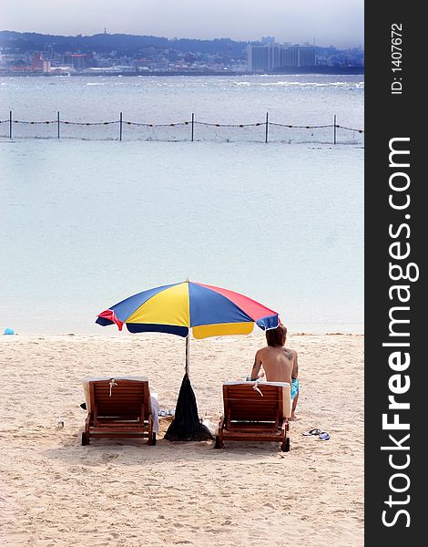 Man relaxing at the Beach ~ Okinawa Horizon. Man relaxing at the Beach ~ Okinawa Horizon