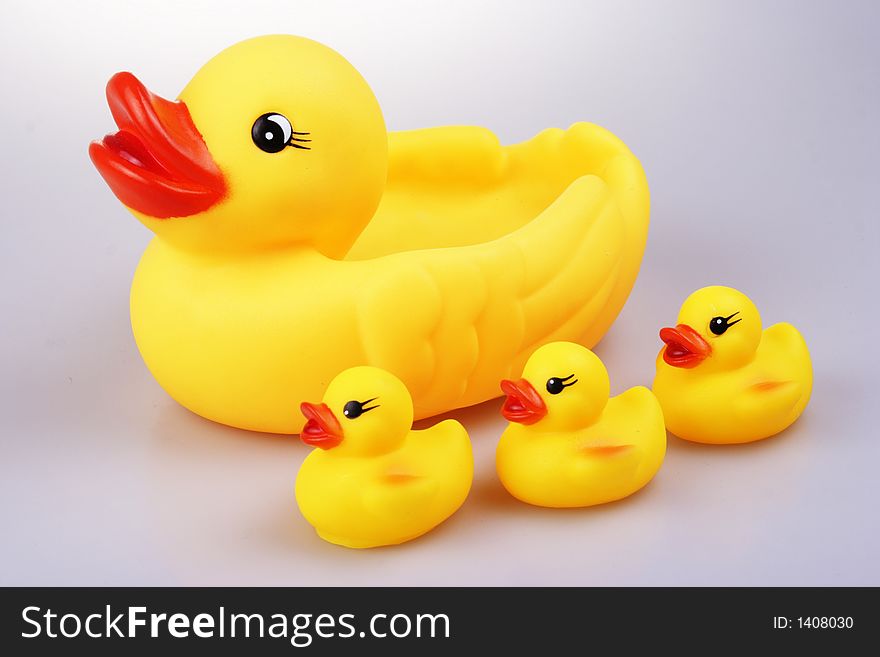 Yellowish rubber duck close up.