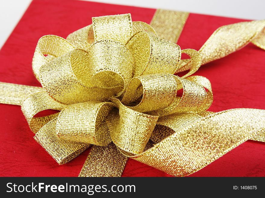 Red gift box with ribbon.
