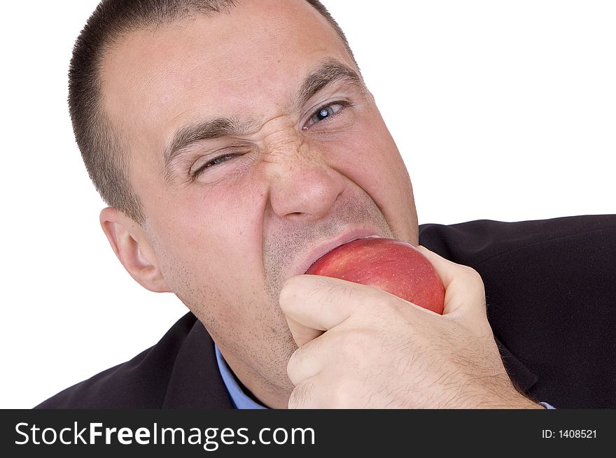 Business man bite a red apple