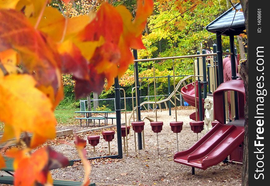 Playground in a park in October; colorful leaves. Playground in a park in October; colorful leaves.