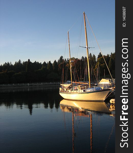 Boat Reflection In Sunset