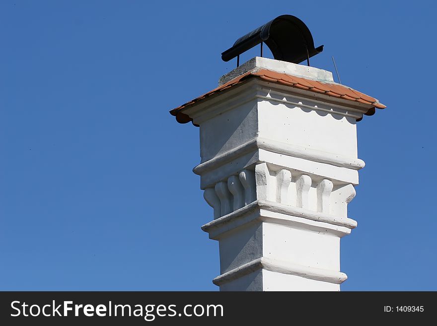 Ornamental chimney isolated on blue