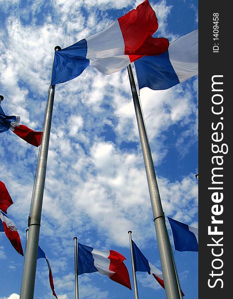 Group of French flags on poles, perspective view. Group of French flags on poles, perspective view