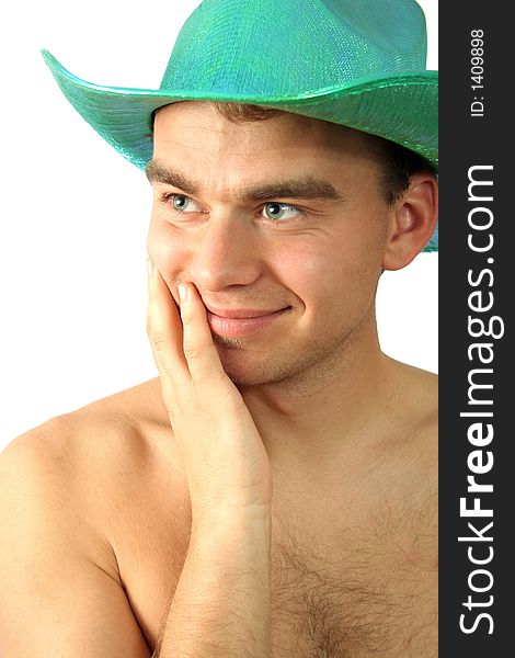 Man in green hat is smiling. Man in green hat is smiling
