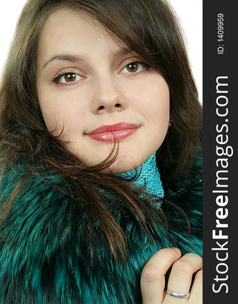 Lovely young woman in furcoat