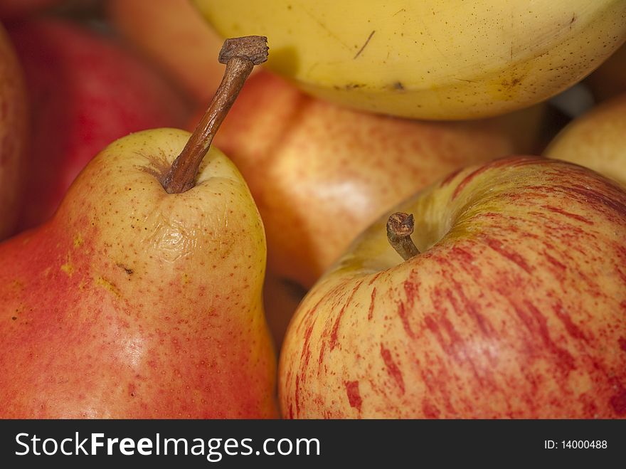 Closeup of a fruit basket with pears and apples