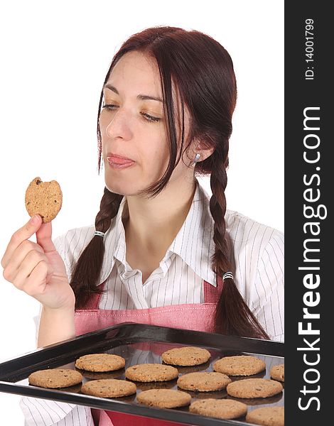 Beautiful housewife eating a slice of chocolate cake