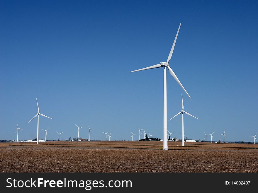 Wind powered generators in farm fields