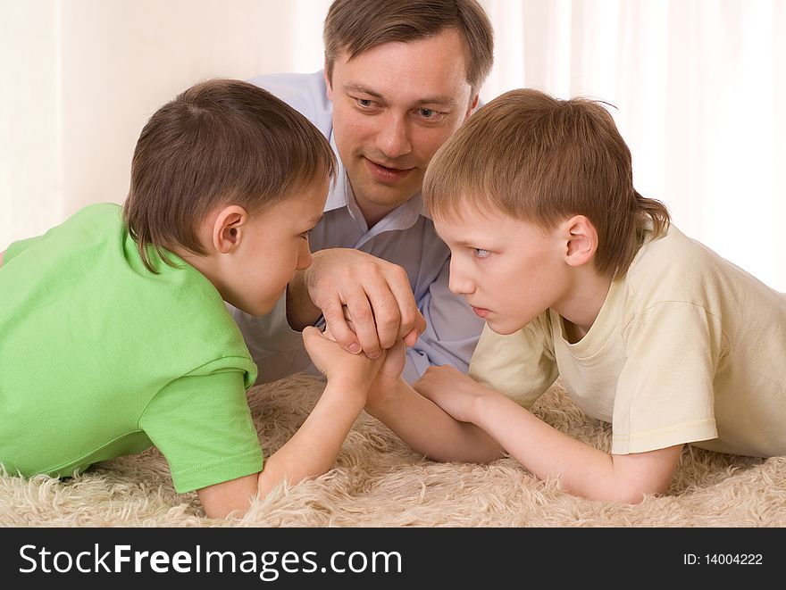 Young father playing with his two children. Young father playing with his two children