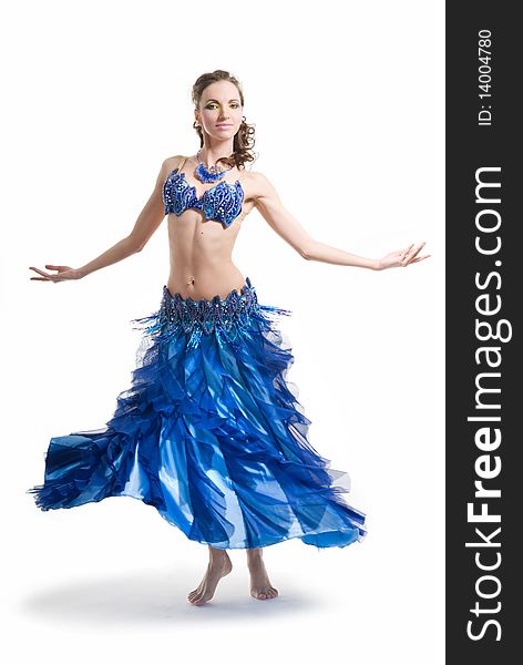 Beautiful woman dancing in blue dress