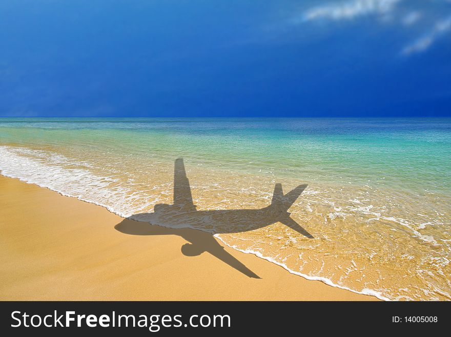 Shadow of plane over tropical beach. Shadow of plane over tropical beach