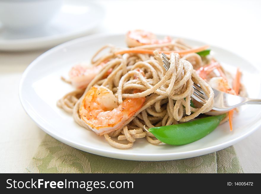 Cold soba noodle salad with shrimp, peas, and carrots