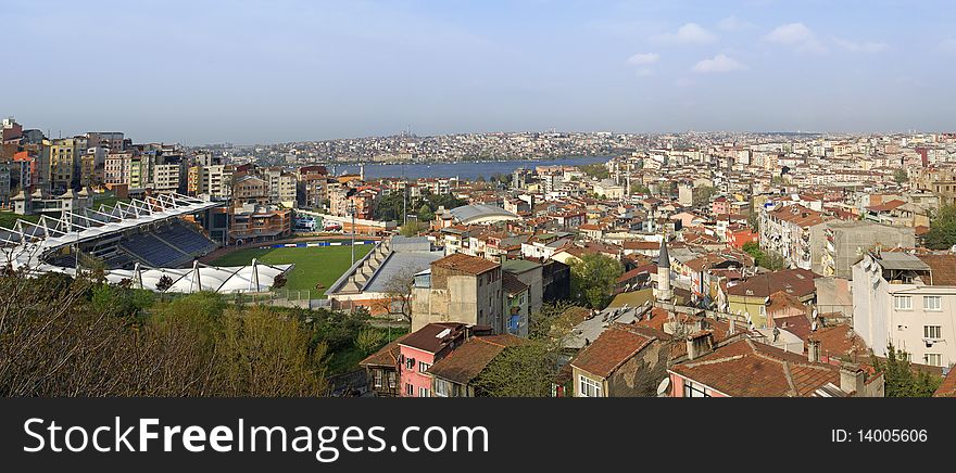 Panoramic view over a residential area of Istanbul, Turkey with a sports stadium in the foreground. Panoramic view over a residential area of Istanbul, Turkey with a sports stadium in the foreground