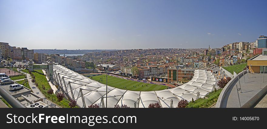 Panoramic view over a residential area of Istanbul, Turkey with a sports stadium in the foreground. Panoramic view over a residential area of Istanbul, Turkey with a sports stadium in the foreground