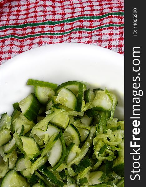 Green small cucumber sliced and grated in bowl