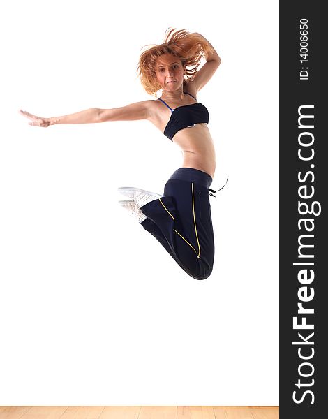 Jumping woman modern ballet dancer in ballroom. Jumping woman modern ballet dancer in ballroom