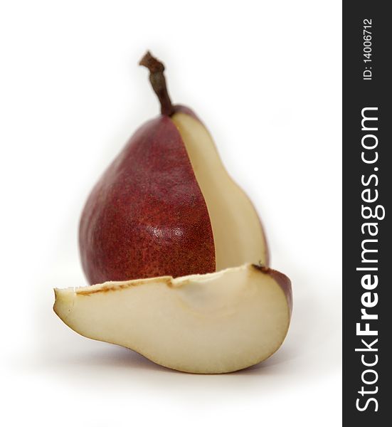 The red cut pear and pear segment on a white background