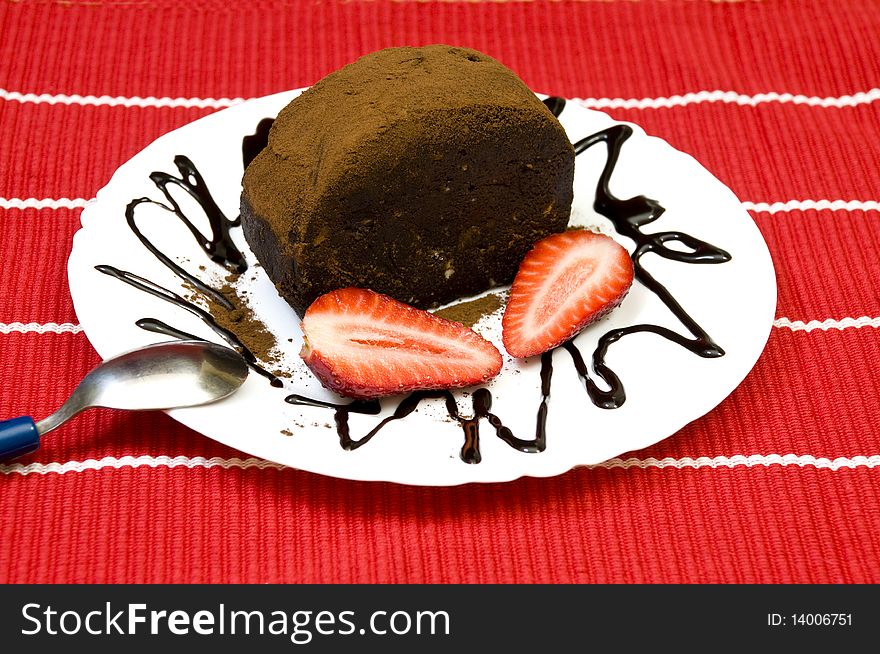 Tasty sweet chocolate cake with fresh strawberries. Tasty sweet chocolate cake with fresh strawberries