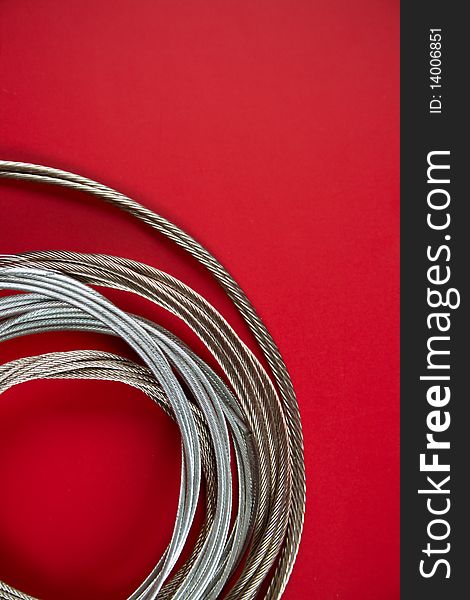 Steel rope on a red background
