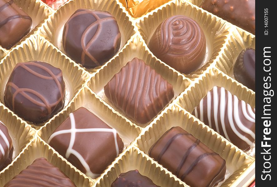 Assortment chocolate pralines in a golden box