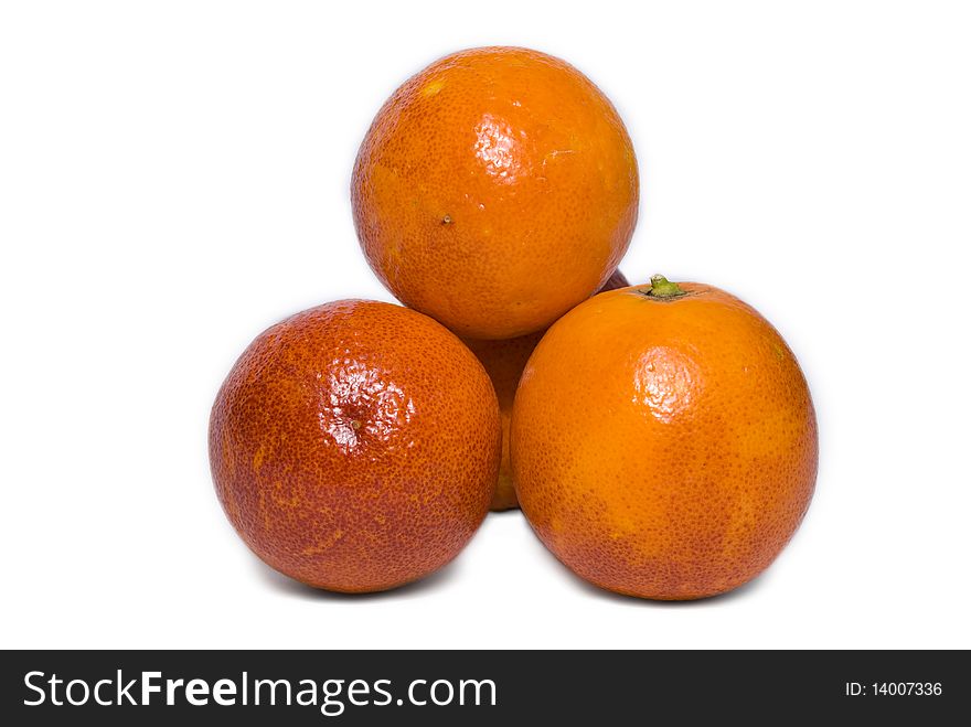 Group of four ripe red oranges in a pyramid isolated on white background. Group of four ripe red oranges in a pyramid isolated on white background