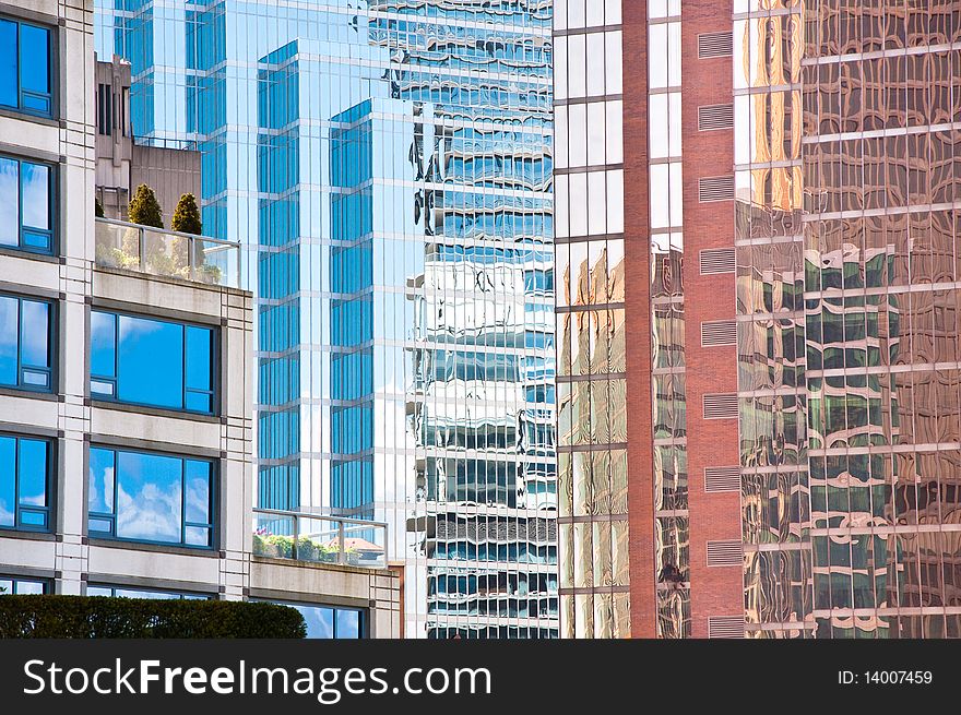 Modern city architecture on a bright sunny day. The small roof garden and terrace contrasts with the urban architecture and busy city lifestyle. Modern city architecture on a bright sunny day. The small roof garden and terrace contrasts with the urban architecture and busy city lifestyle.