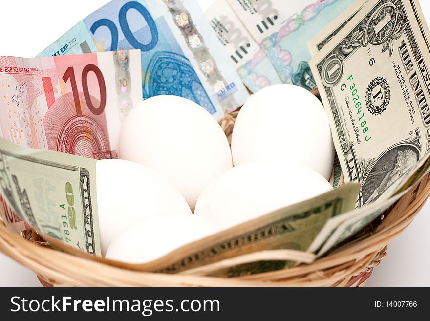 Eggs with money in basket closeup